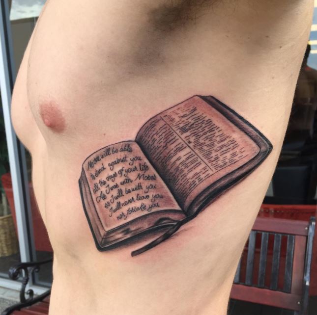 Bible Quote Tattooed Against the Image of a Bible Page