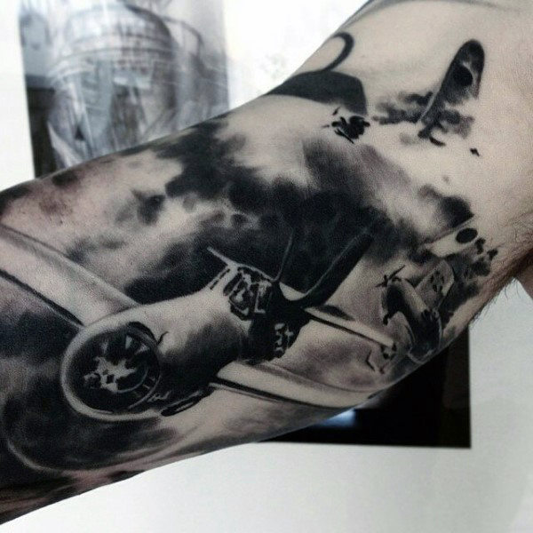 Creative Tattoo of a Military Airplane in the Clouds