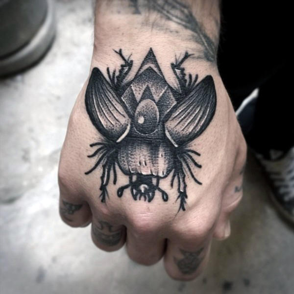 Egyptian-Inspired Beetle Hand Tattoo Idea for Men