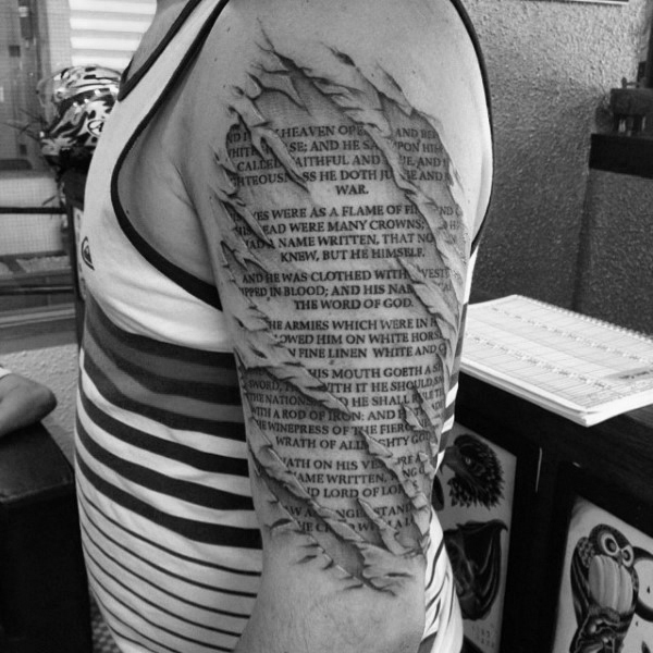 Outer Arm Tattoo of a Bible Verse Typed on Scroll Paper