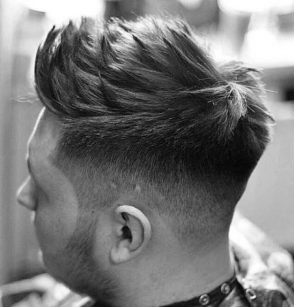 Spiked Up Wavy Hairstyle for Men with Casual Curls