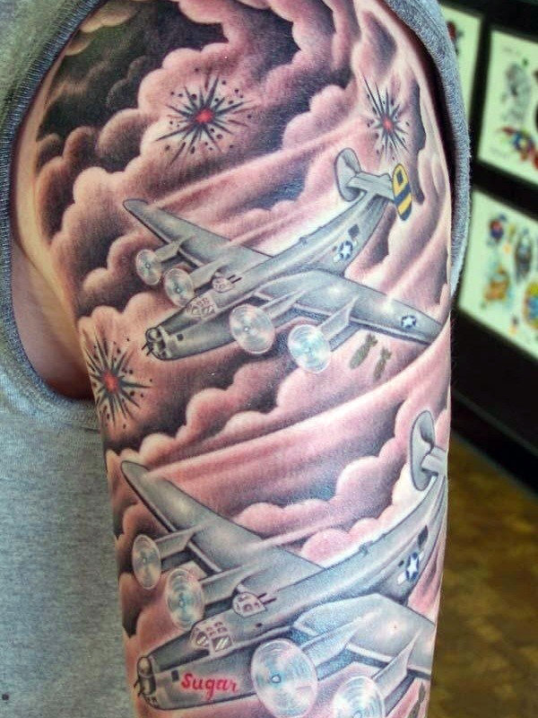 Tattoo of Imagery Showing Military Jets Blasting Through Stormy Weather