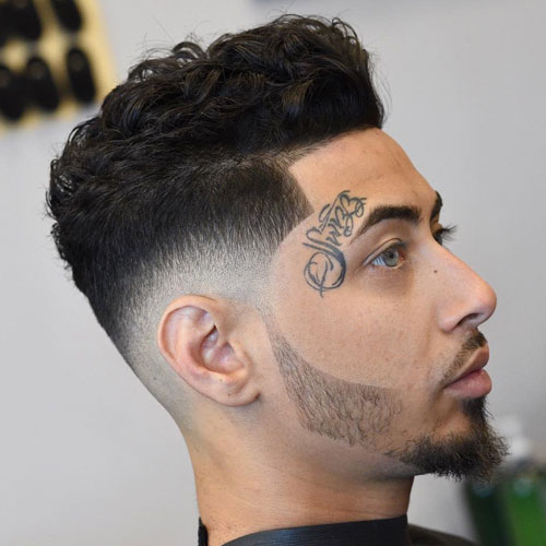 Wavy Hairstyle Idea for Men with Facial Tattoos