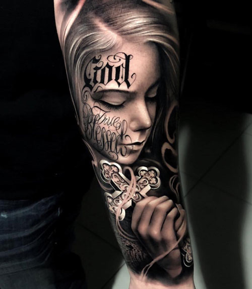 Forearm Portrait of a Tattooed Girl Holding a Ribboned Cross