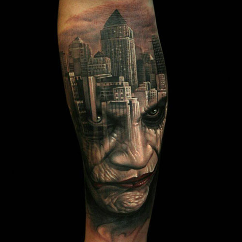Imagery of a City Over the Tattooed Visage of a Man