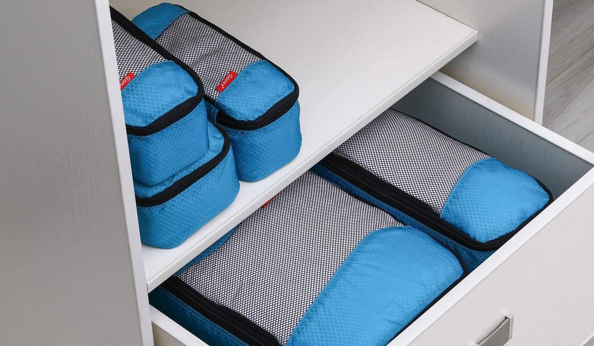 blue packing cubes in a drawer