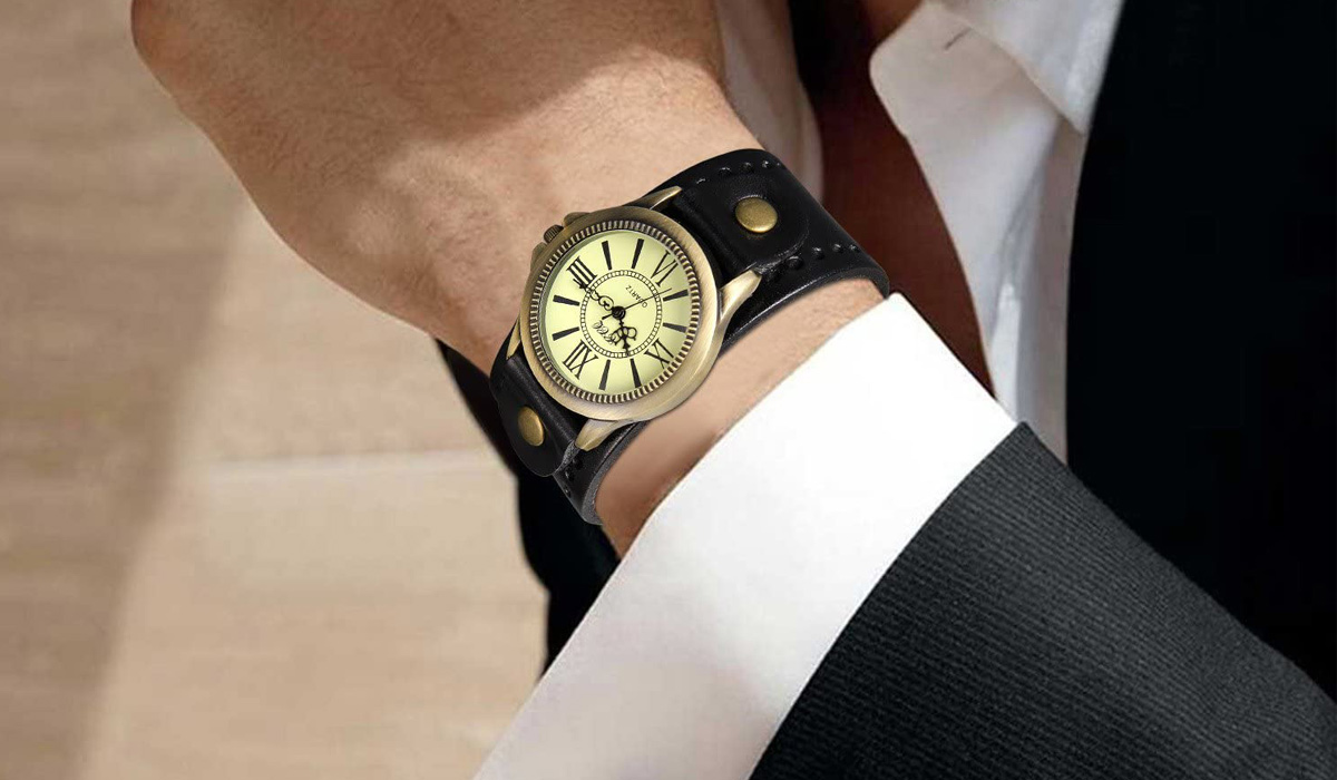 bronze watch with a black leather strap