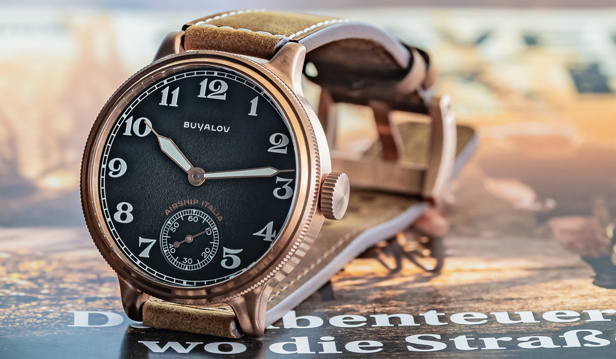 bronze watch with a brown leather strap