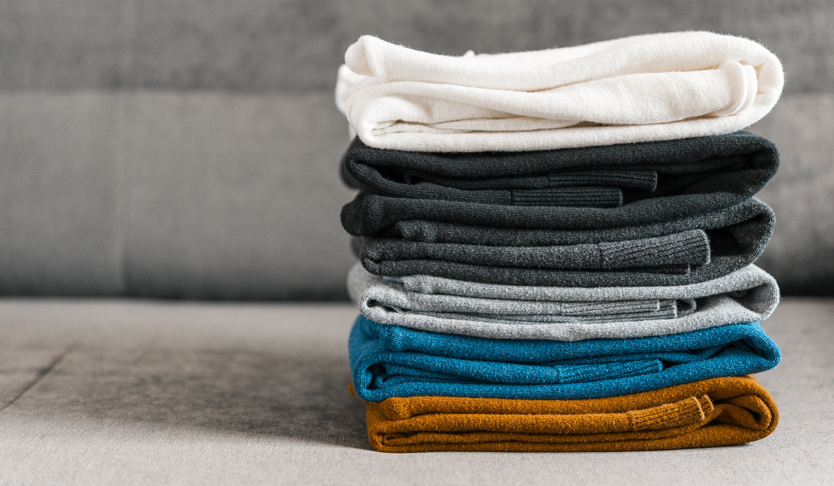 pile of affordable cashmere sweaters for men